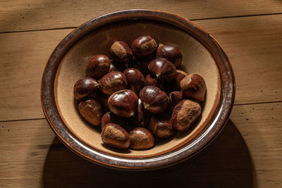 High angle view of blueberries in bowl on table