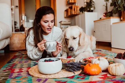 Portrait of a young man drinking dog