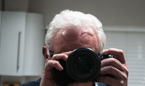 Portrait of man photographing