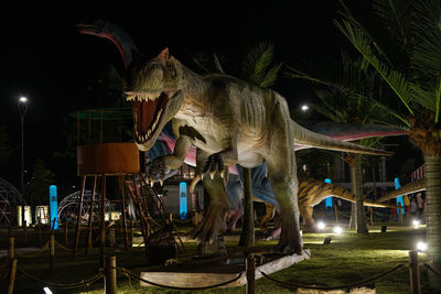 Sculpture of illuminated traditional building at night