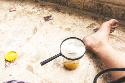 High angle view of hand with drink