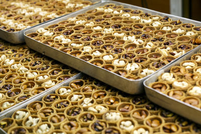 Baklava arranged in trays at store for sale