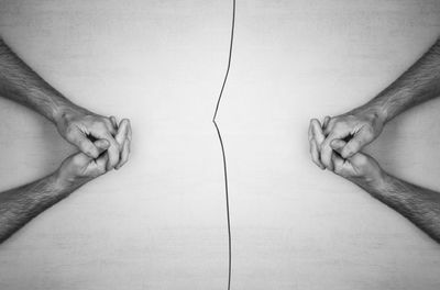 Low section of man and woman standing against white background