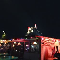 Low angle view of illuminated building at night