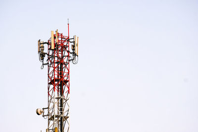 Low angle view of communications tower against clear sky