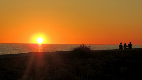 Scenic view of sea at sunset