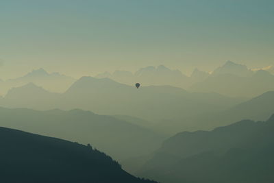 Silhouette of hot air balloon against clear sky