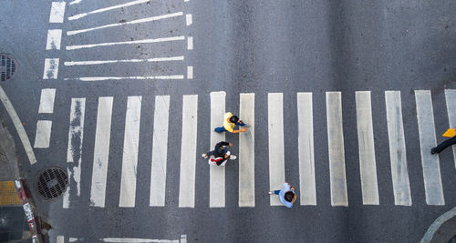 High angle view of people crossing road