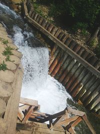 High angle view of water flowing on dam