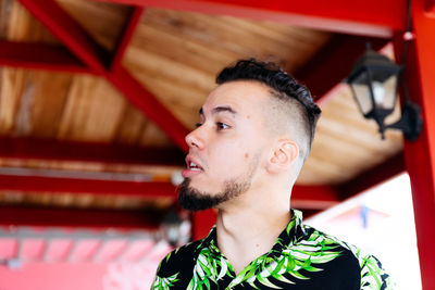 Portrait of young man looking away