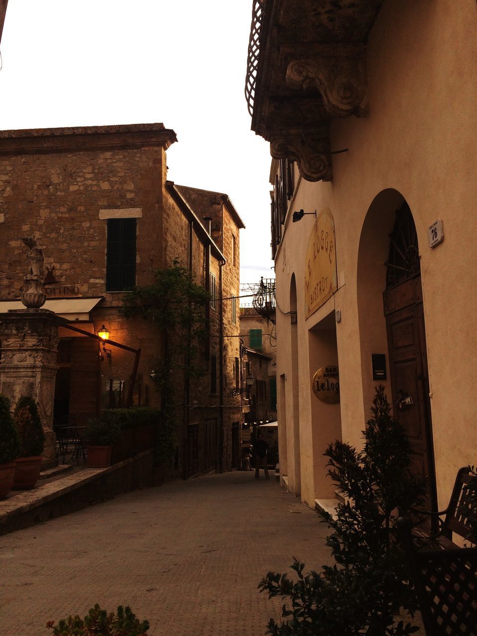 STREET AMIDST BUILDINGS AGAINST SKY