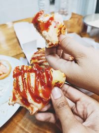 Close-up of hand holding ice cream