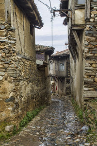Narrow alley amidst buildings in town