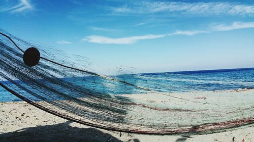 Scenic view of sea against blue sky