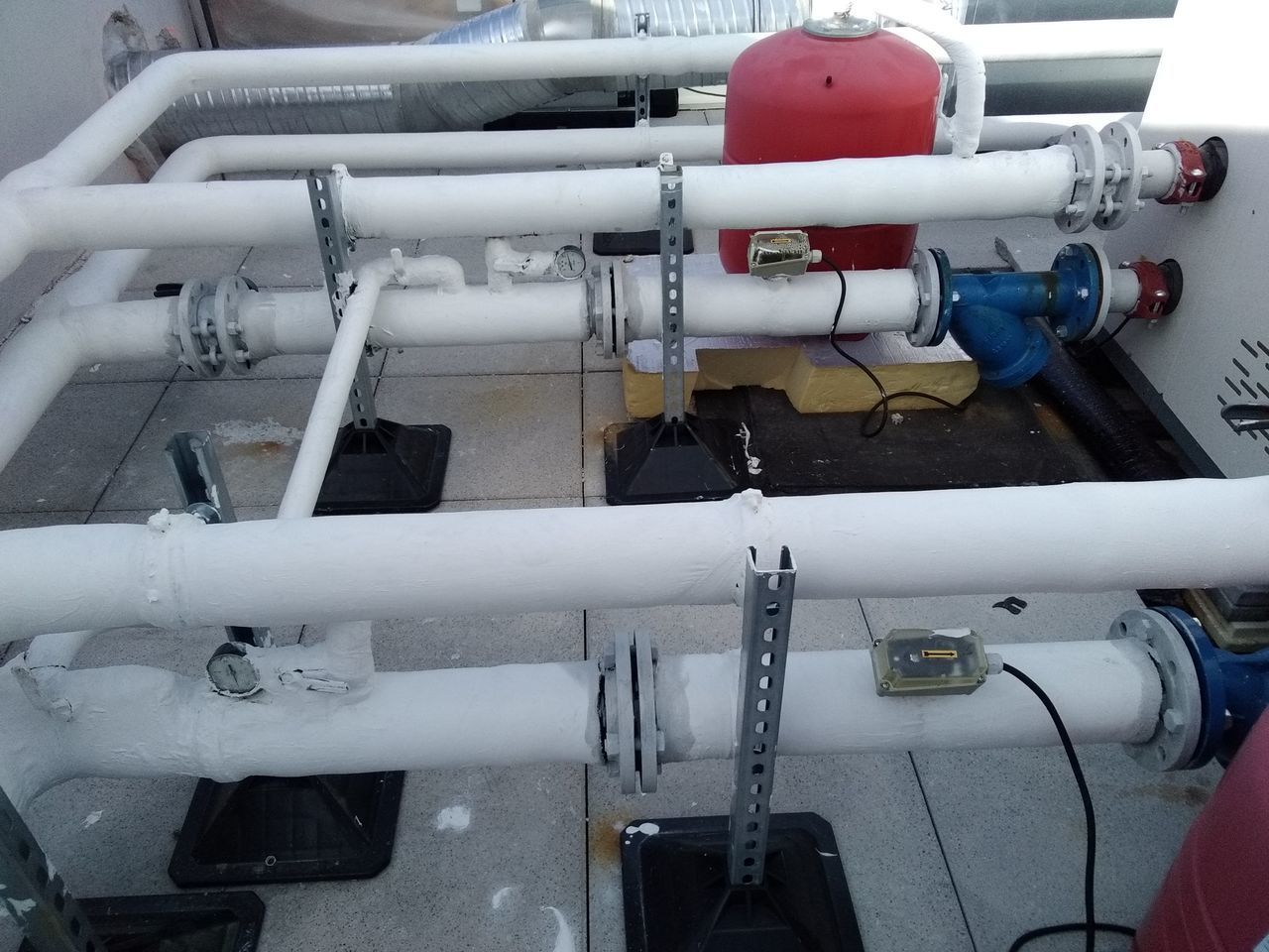 HIGH ANGLE VIEW OF PIPES ON AIRPLANE AT AIRPORT