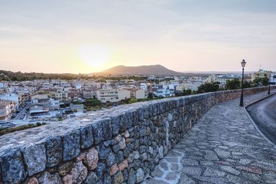 Panoramic view of city against sky during sunset