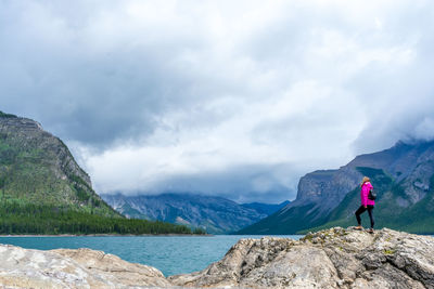 Man standing on mountain against sky