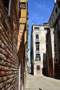 Narrow alley amidst buildings in city