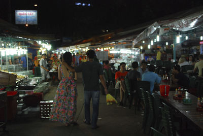 People at market stall