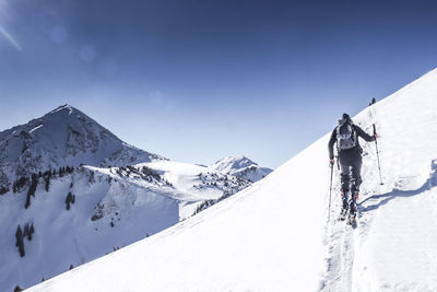 Scenic view of snowcapped mountains against clear sky