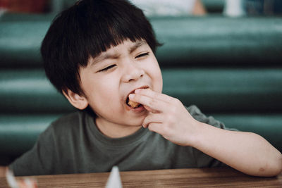 Portrait of boy looking at table