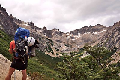 Rear view of man hiking on mountain