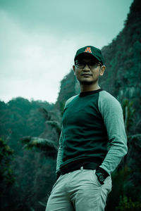 Full length portrait of boy standing on land