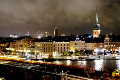 Illuminated buildings in city at night