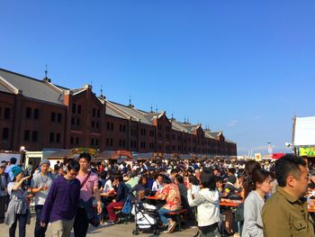 People at town square against clear sky