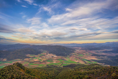 Scenic view of agricultural landscape against sky