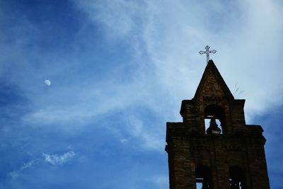 Low angle view of old bell tower against sky