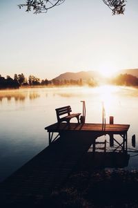 Gazebo on lake against clear sky