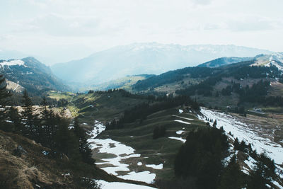 Scenic view of snowcapped mountains against sky