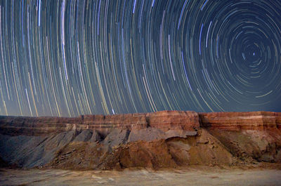 Low angle view of light trails at night