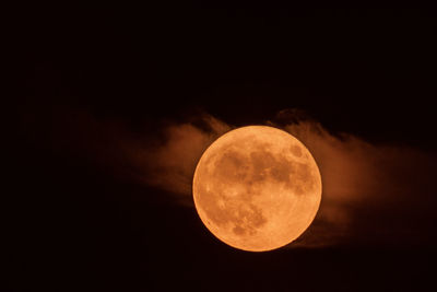 Low angle view of moon against sky at night