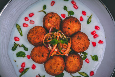 High angle view of fruits in plate on table