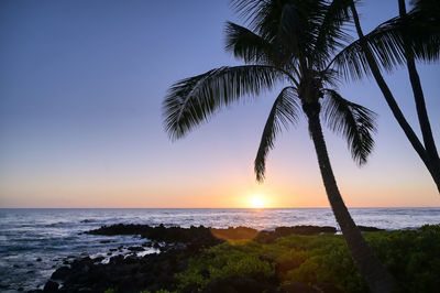 Scenic view of sea against sky at sunset