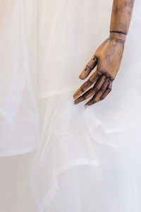 Close-up of mannequin in wedding dress at clothing store