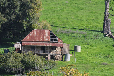 Abandoned building on field