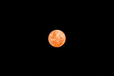 Low angle view of moon against clear sky at night