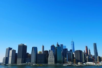 East river against modern buildings at manhattan