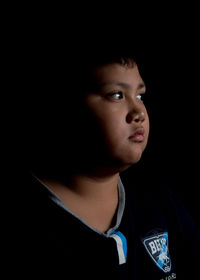 Close-up portrait of boy looking away