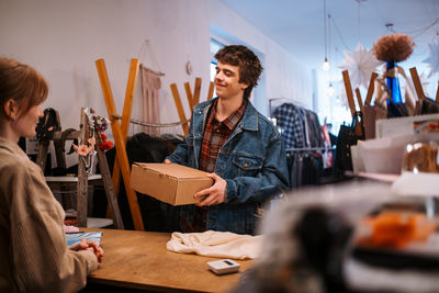 Portrait of young woman working on table
