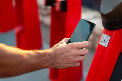 Close-up of man using mobile phone