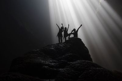 Low angle view of silhouette people