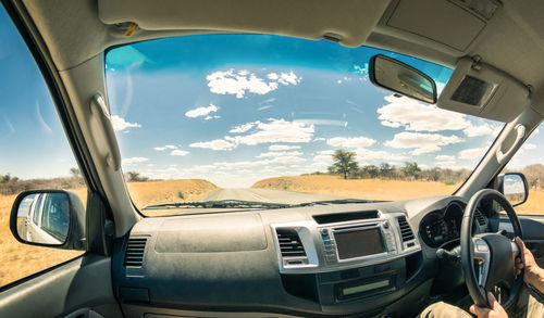 Reflection of sky seen through car window