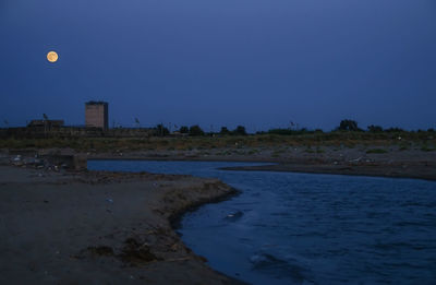 Scenic view of moon against clear sky at night