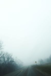 Scenic view of field during foggy weather