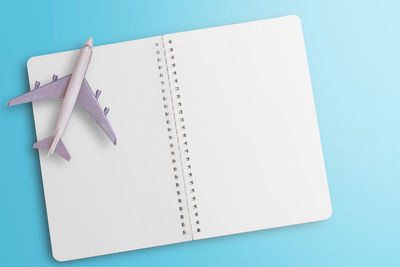 High angle view of pen on table against blue background