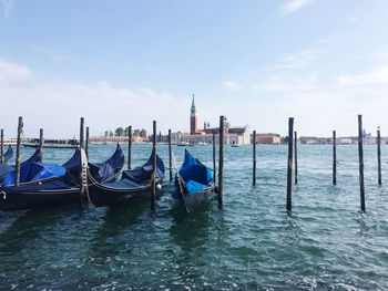 Boats in sea against sky